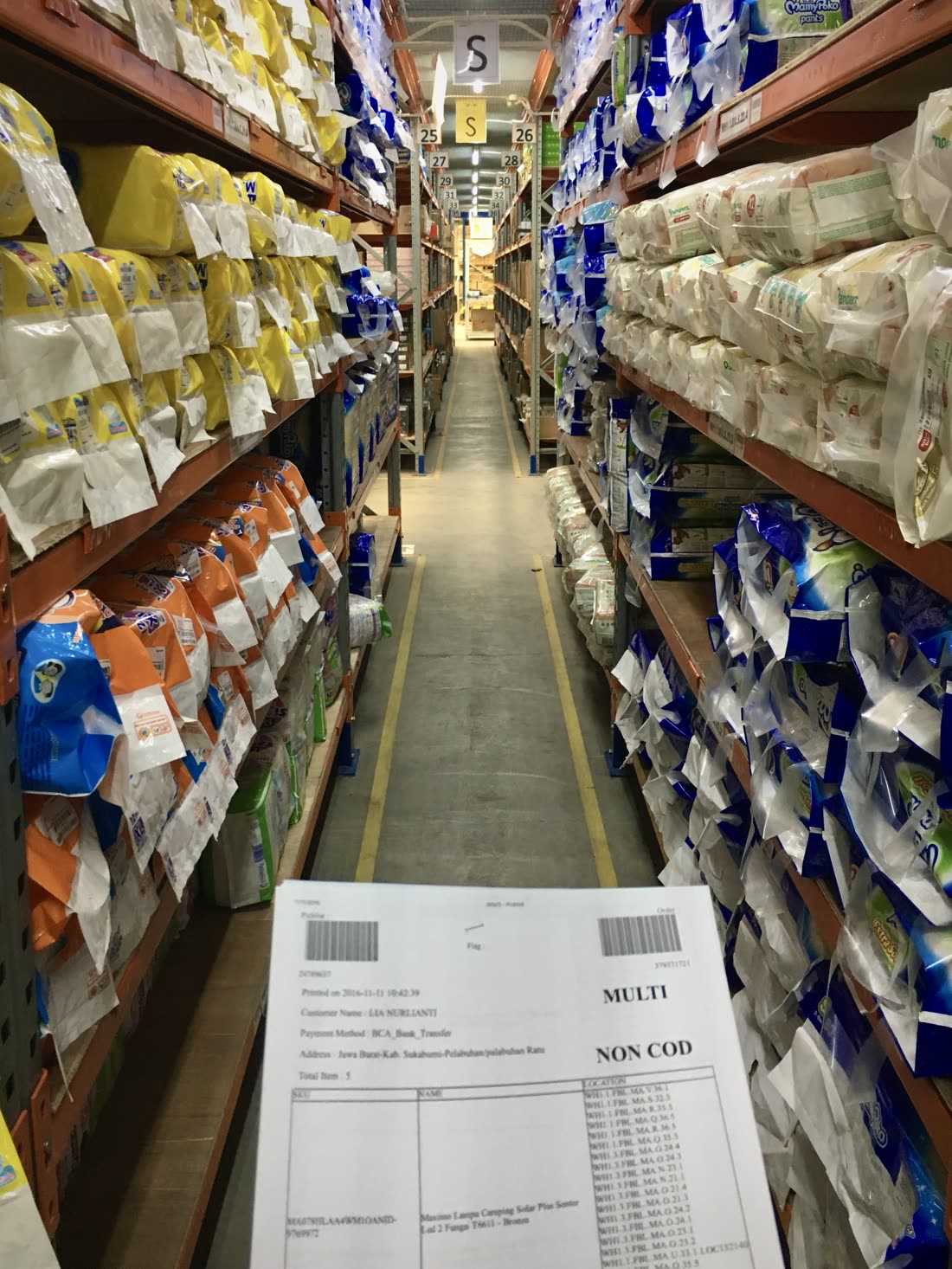 Zing picking stock on a Lazada fulfilment warehouse floor